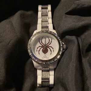 White bracelet crystals bezel quartz movement 50 meters water resistant.